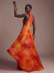 Back view of abstract print halter neck maxi dress