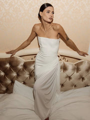 Strapless white sheath dress styled for evening elegance
