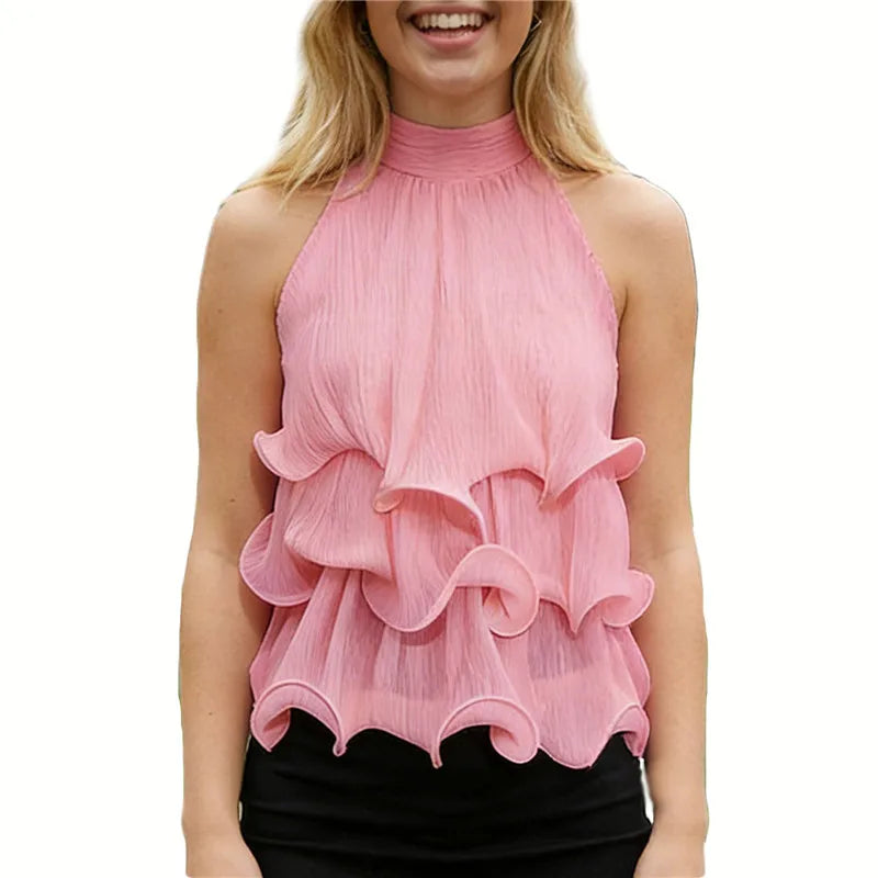 Pink halter neck ruffle crop top on a smiling woman.