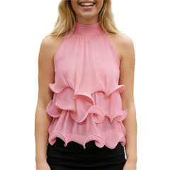 Pink halter neck ruffle crop top on a smiling woman.