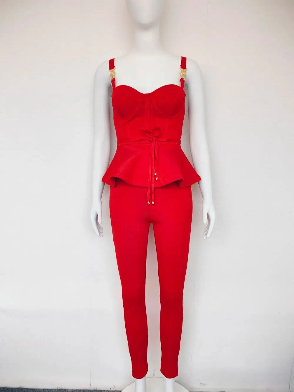 Red outfit on a mannequin against a white background