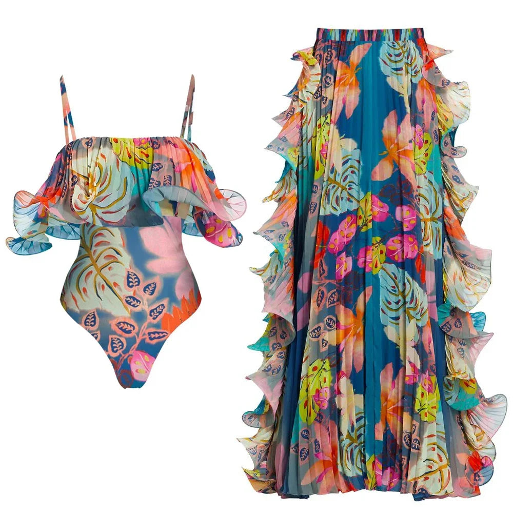 Tropical print one-piece swimsuit and matching ruffled skirt displayed separately.