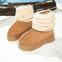 Pair of brown slippers with cream-colored fuzzy trim on a white surface.