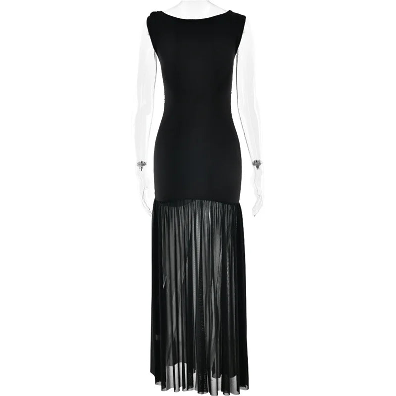 Black dress with sheer pleated skirt on a white background