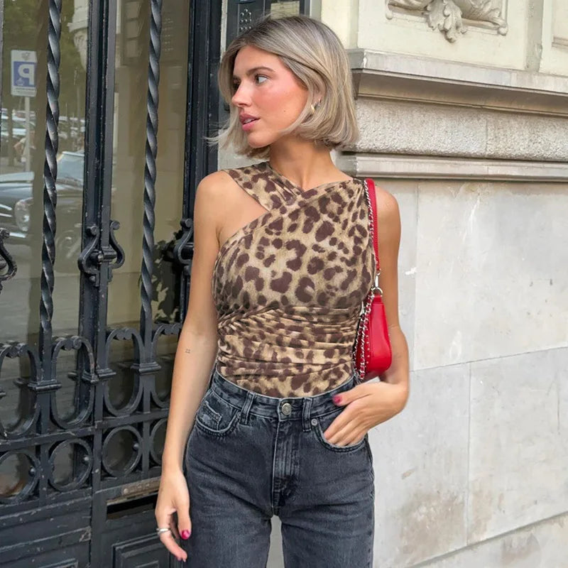 Leopard print one shoulder romper on a model