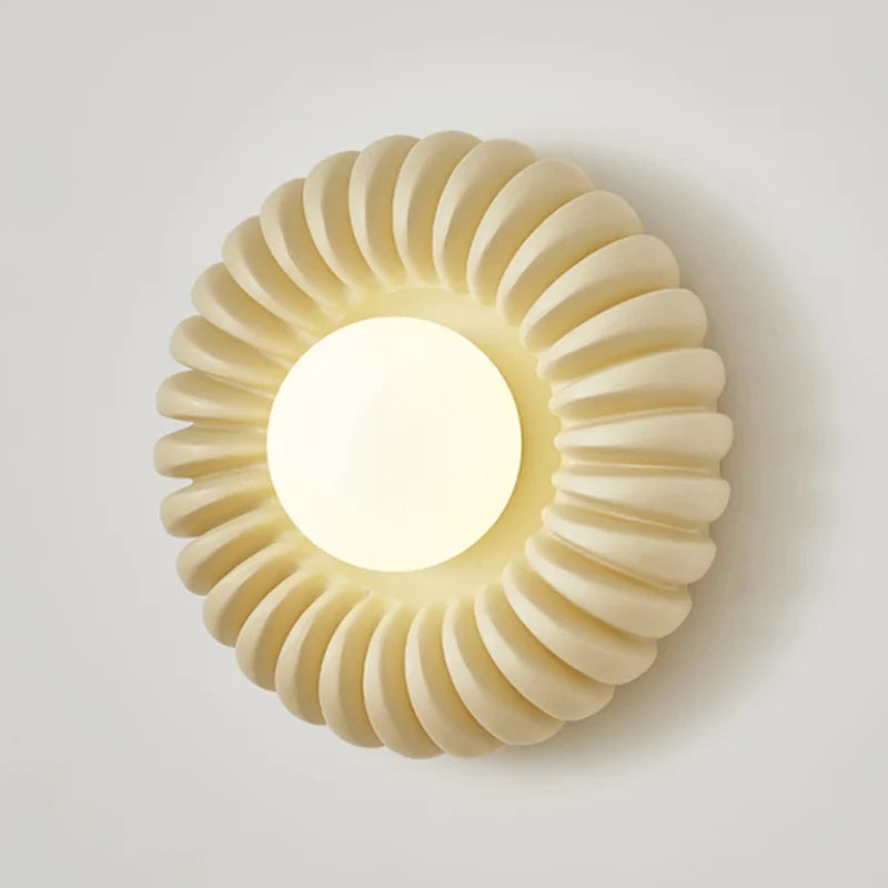 Close-up of a Parisian wall sconce highlighting its sleek lines and translucent milk white glass. IVORY