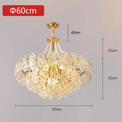 Gold chandelier with crystal details and dimensions on a gray background