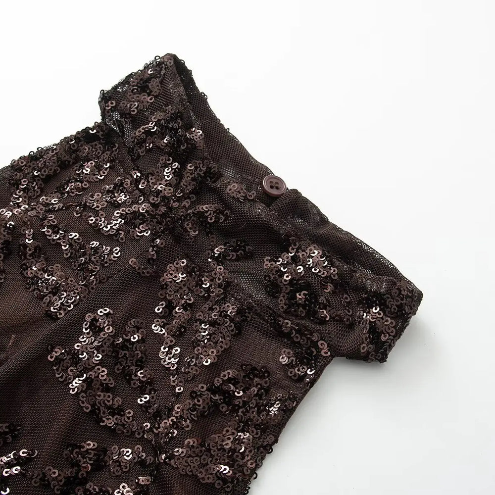 Black sequin fabric on a white background
