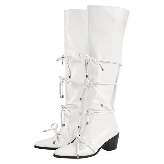 White pointed toe knee high boots with bow detail and block heel