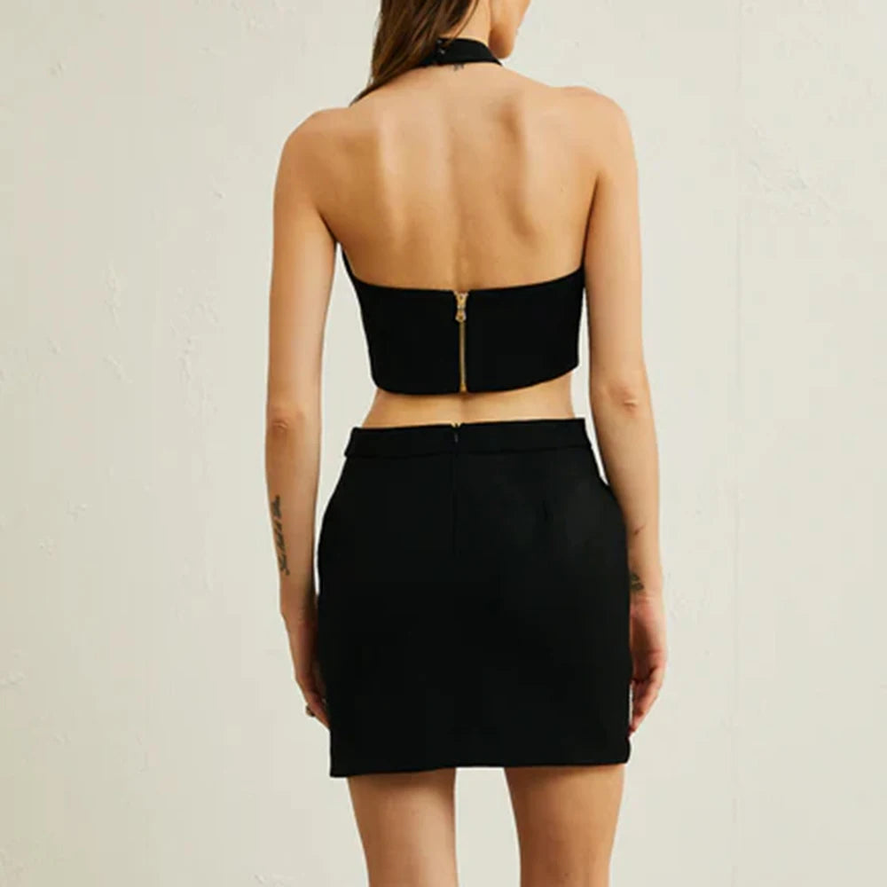 Black strapless top and skirt set on a neutral background