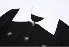 Close-up of black knit cardigan collar and crystal buttons