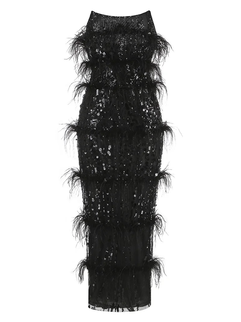 Detailed view of the black sequin and feather embellishments on the gown.