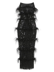 Detailed view of the black sequin and feather embellishments on the gown.