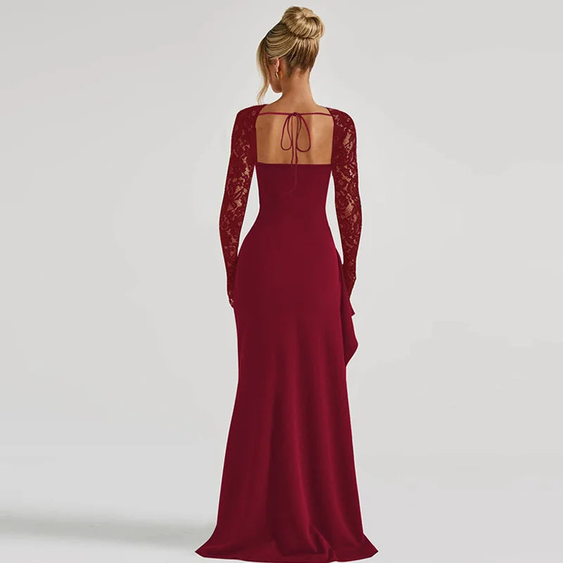 Red evening gown with lace sleeves on a plain background