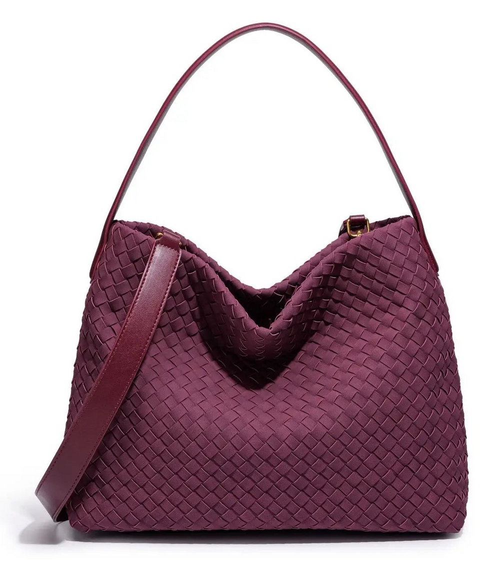 Maroon woven handbag on a white background