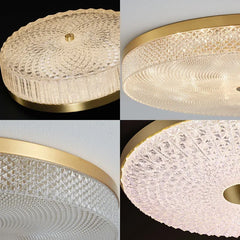 A modern round acrylic ceiling light with LED lights, illuminating a contemporary living room.