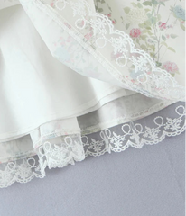 White lace fabric on a gray background