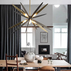 Sleek modern pendant lights hanging above a dining room table, creating a sophisticated atmosphere. Golden Atelier 3