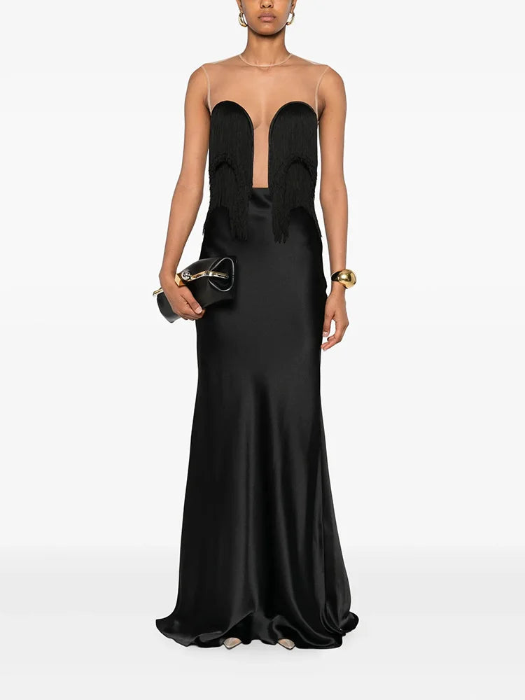 Black strapless gown with cut-out design on a white background