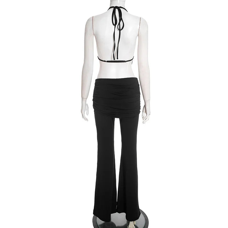Mannequin wearing a black and white outfit with a halter top and flared pants on a white background