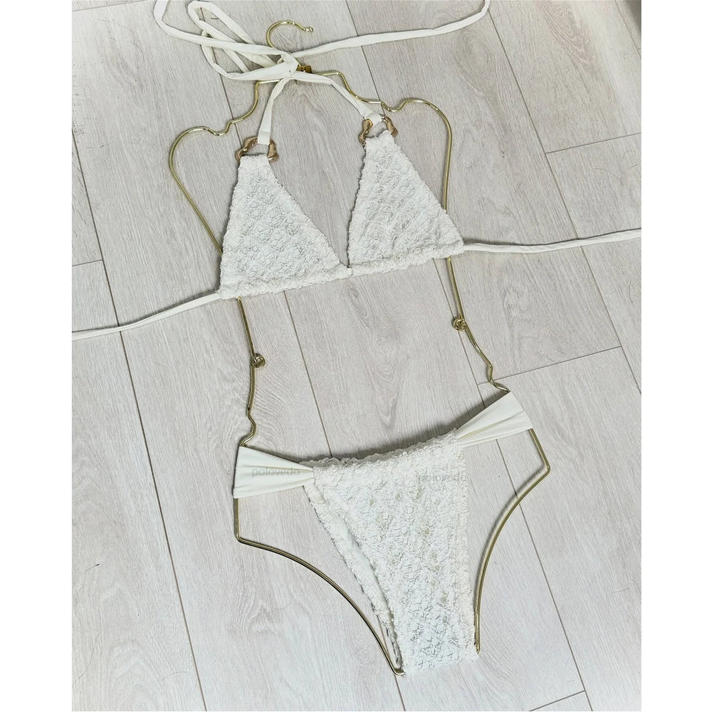 White crochet bikini set displayed flat.