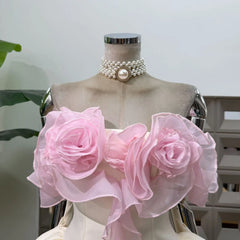 Close-up of 3D floral appliques on strapless dress neckline