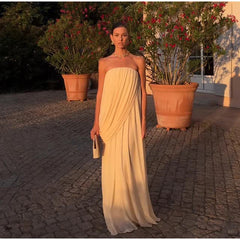 Strapless draped maxi dress in a garden setting