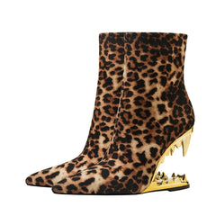 Pair of leopard print ankle boots with a pointed toe and stiletto heel, showcasing their bold design.. Golden Atelier 4