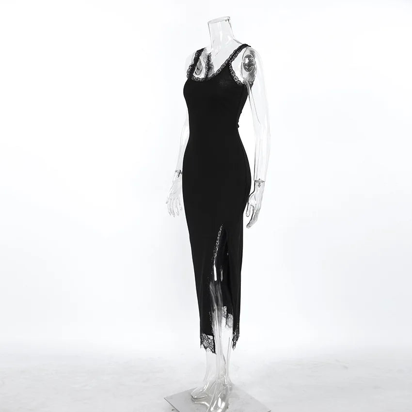 Black dress with lace details on a mannequin against a white background