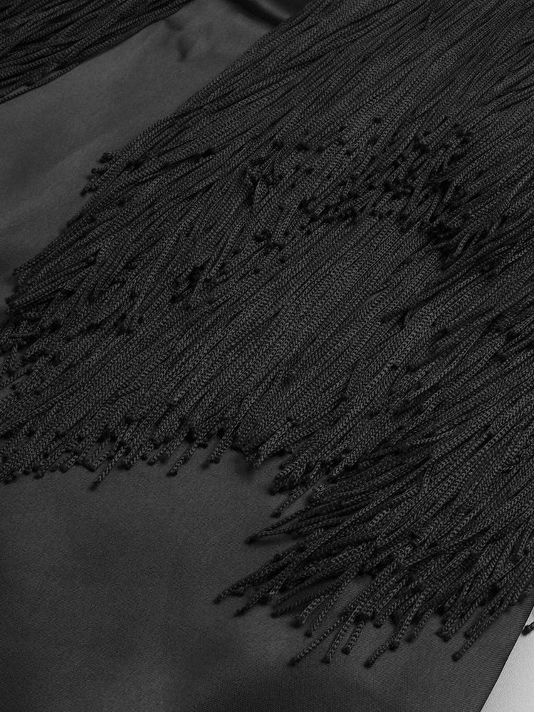 Close-up of a black textured fabric with intricate patterns