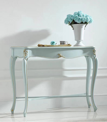 Decorative console table with a vase of blue flowers on a white background