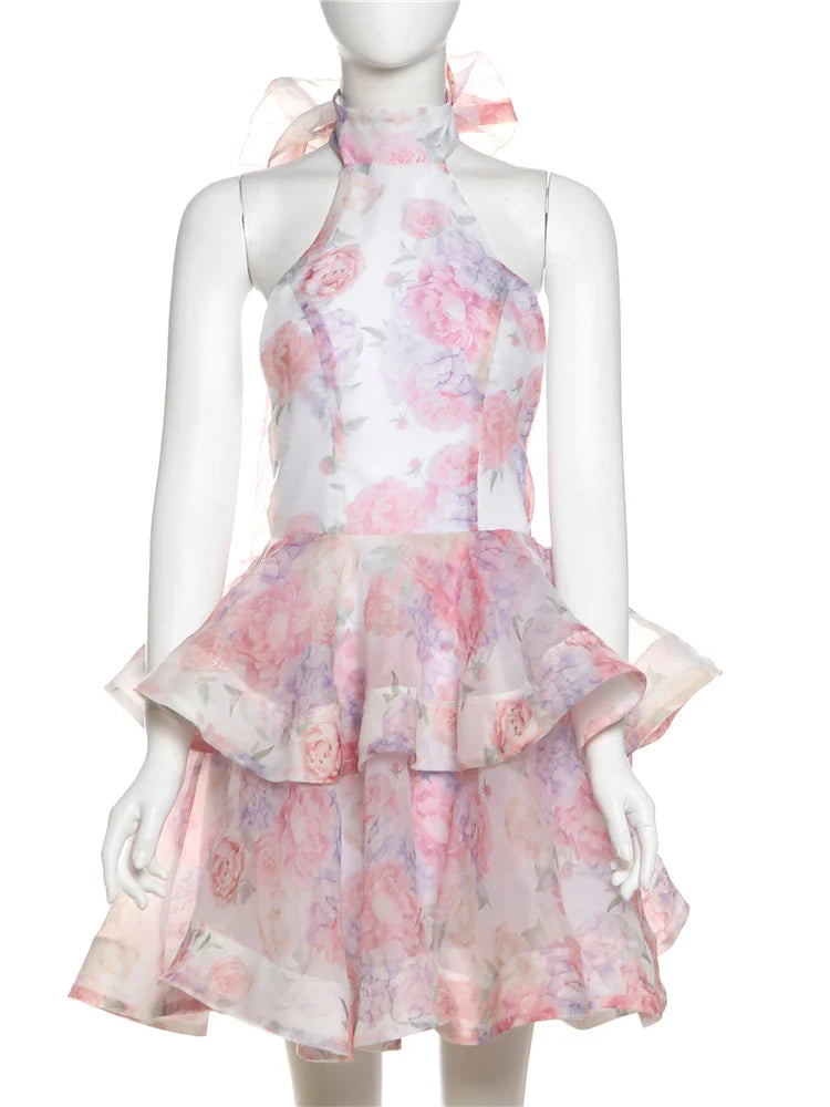 Floral dress on a mannequin against a white background