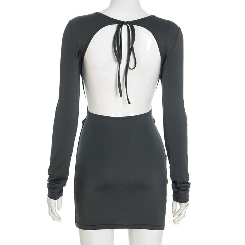 Black dress with sheer back panel on a mannequin against a white background