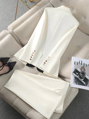 White blazer with buttons on a beige sofa with black shoes and a magazine.