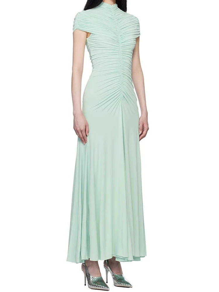 Mint green evening gown on a white background
