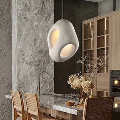 A modern Wabi-sabi style LED chandelier illuminating a cozy Dining Room interior. 1