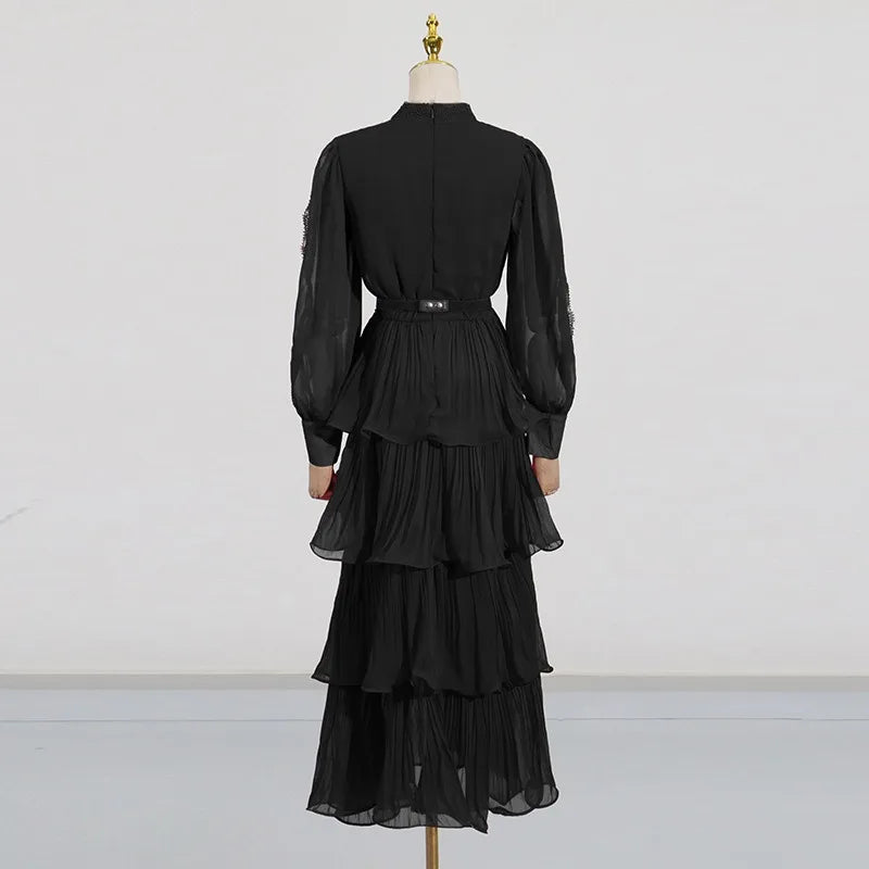 Black dress on a mannequin against a white background