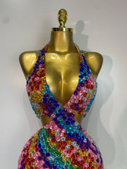 Close-up of the bodice of a halter neck mini dress with rainbow diamond embellishments