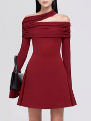 Red off-shoulder dress worn by a model on a white background