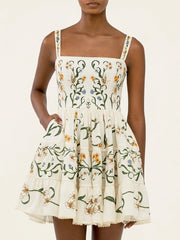 Close-up of botanical print square neck mini dress