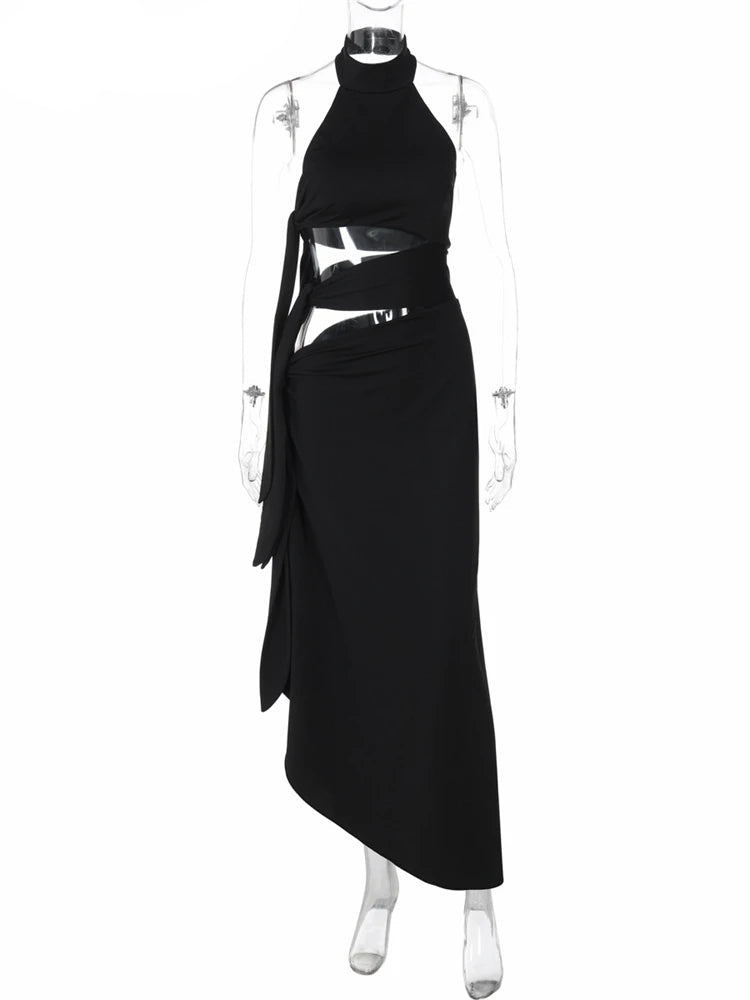 Black halter neck dress with cut-out design on a mannequin against a white background, brand 'Nsauye' visible.