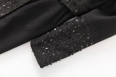 Detail of sequin embellishment on coat sleeve