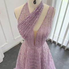 Mannequin displaying  the lilac beaded evening gown, showcasing its elegant silhouette and flowing train. Golden Atelier 4