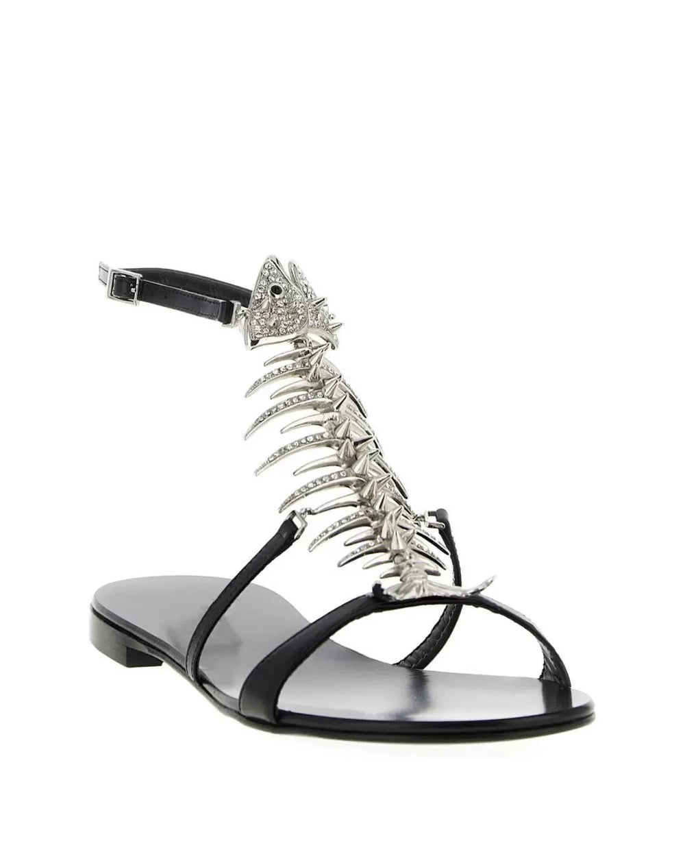 Black flat sandal with a silver rhinestone fishbone embellishment and ankle strap