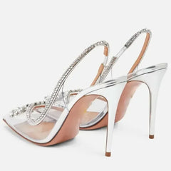 Crystal transparent pumps featuring thin heels for a sleek look.