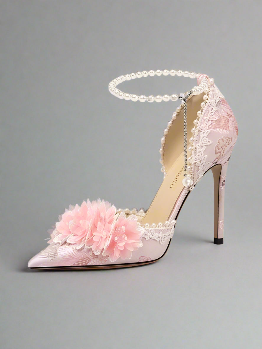 Pink high-heeled shoe with floral design and chain detail on a white background, branded 'LILY WEI'.