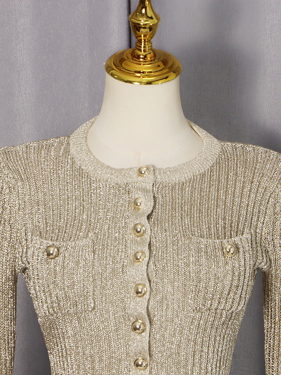Knitted cardigan with button details on a mannequin against a gray background