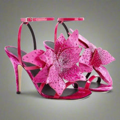 A pair of elegant suede high heel shoes adorned with delicate flower-shaped crystal embellishments.