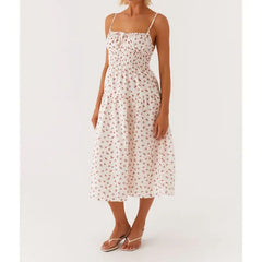 Woman wearing a white floral dress on a white background