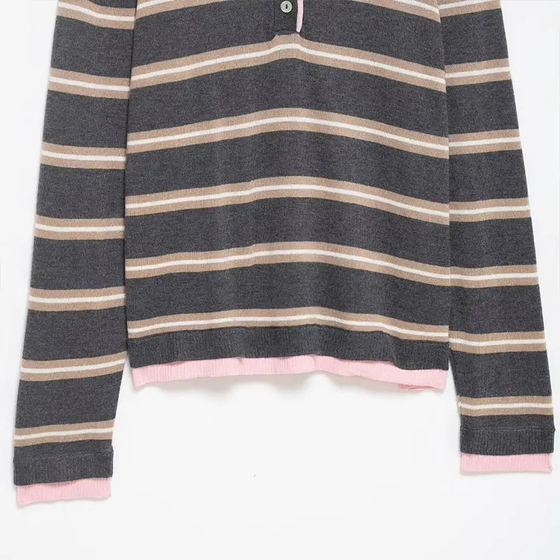 Striped long-sleeve shirt with pink trim on a white background